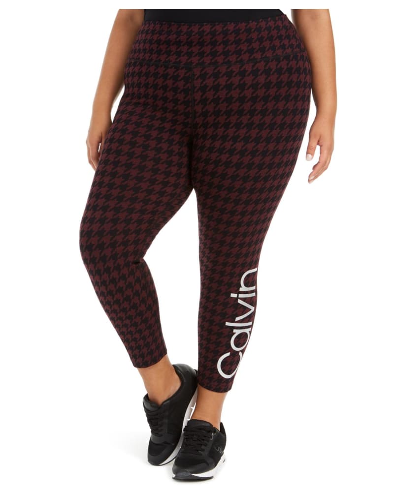 Front of a model wearing a size 3XL Calvin Klein Women's Printed Logo Leggings Maroon 3XL in Red by Calvin Klein. | dia_product_style_image_id:307292